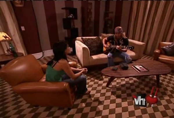 Douche holds court. Apparently the guitar is surgically attached